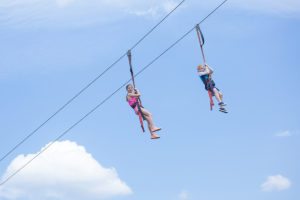 siblings zip-lining